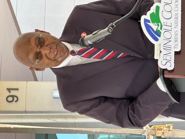 Justice Perry speaking at a community event